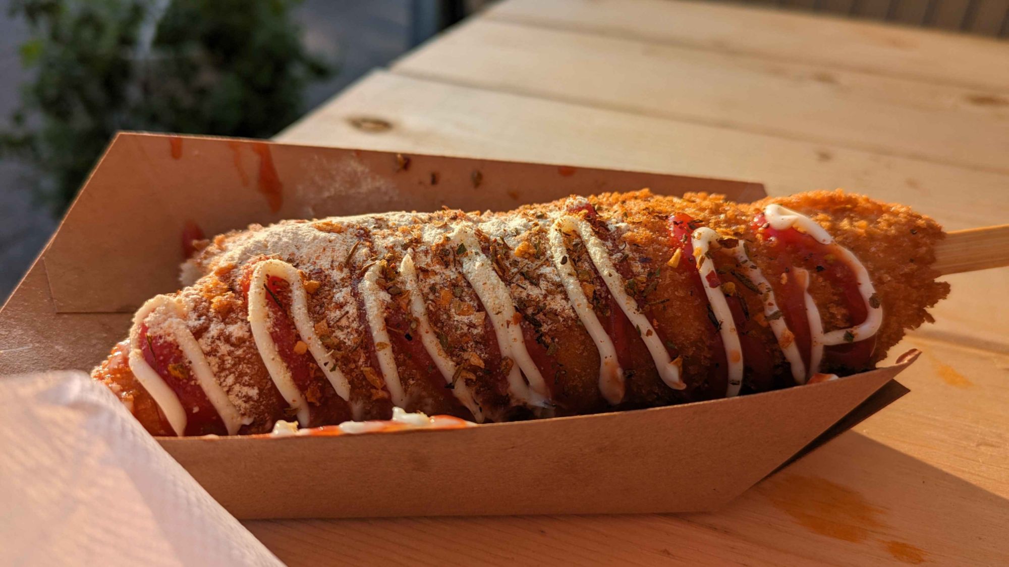 Korean corn dog with mustard from the Parkdale Night Market in Ottawa, ON